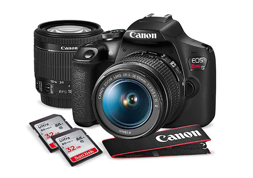 Canon mirrorless EOS camera with extra lens and 2 SD cards